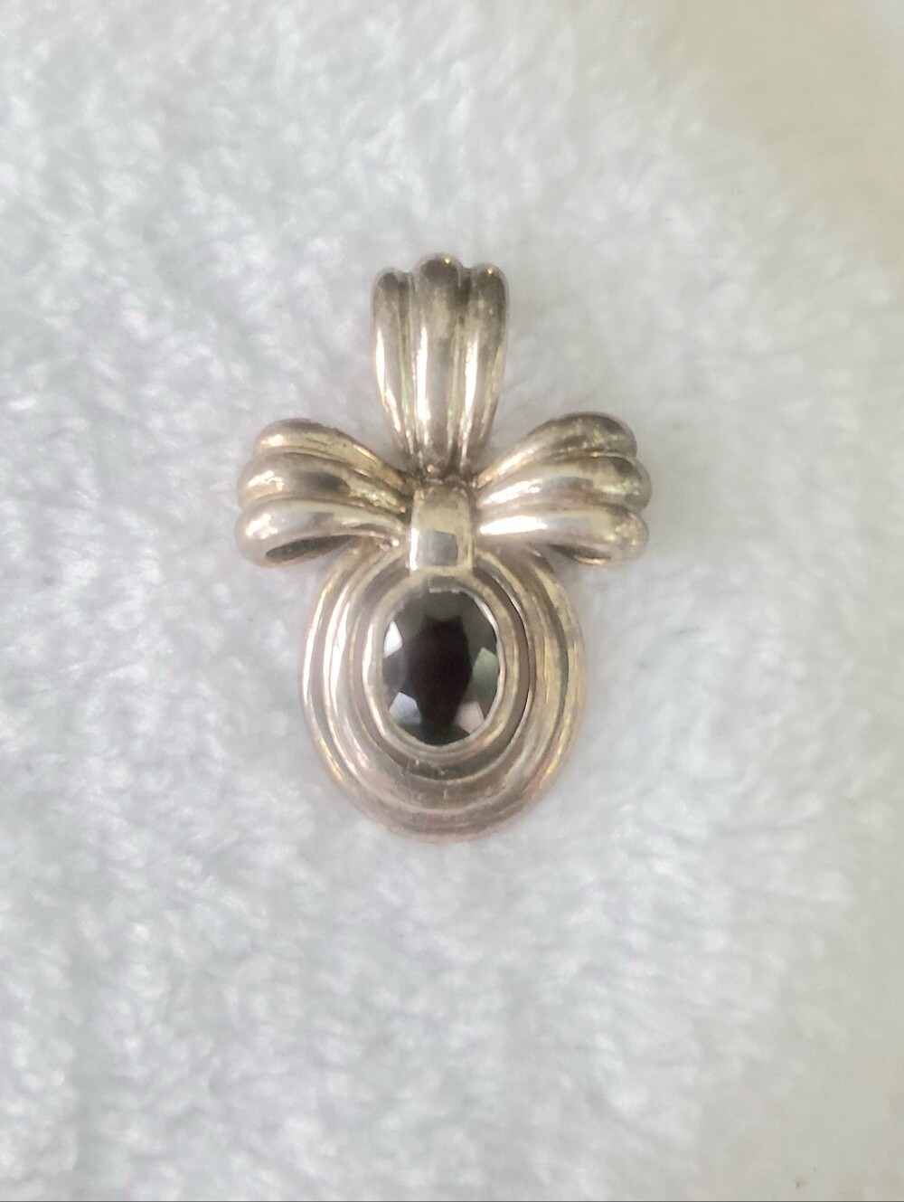 Sterling silver red garnet ribbon pendant